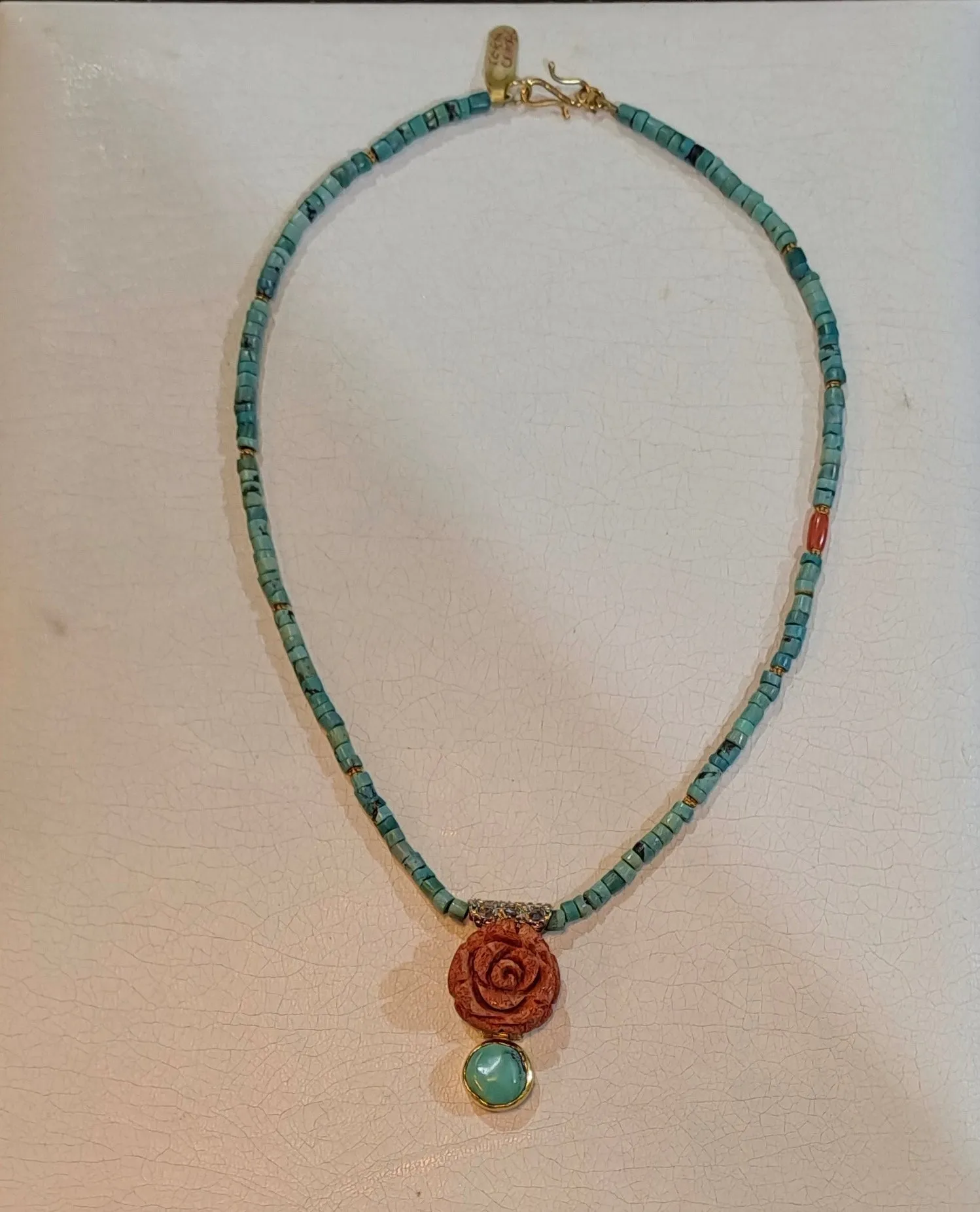 Necklace in turquoise stones and coral stones, coral stone in rose design, white 18k gold