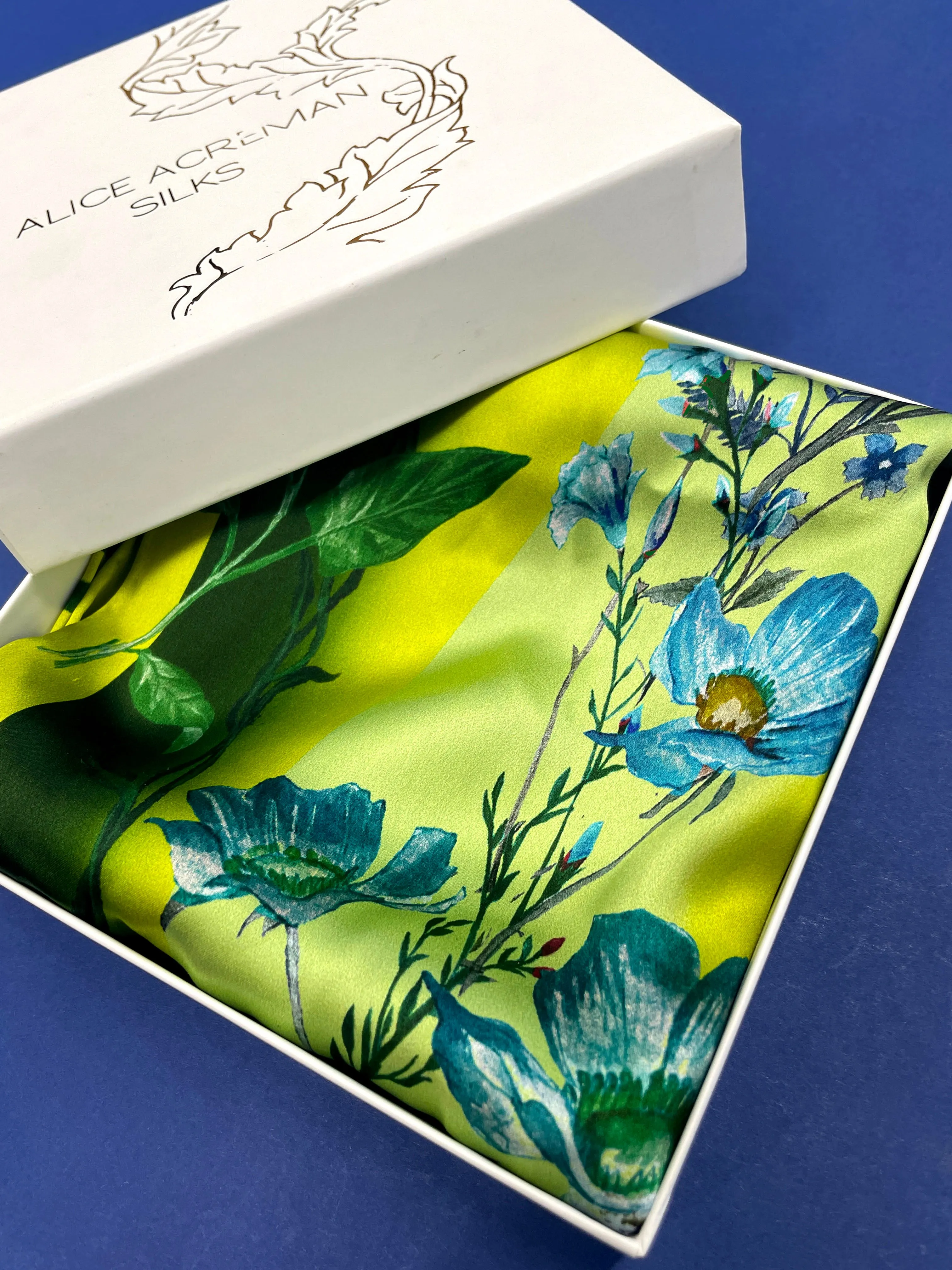 Vibrant yellow and pale blue ‘Luciferin’ floral silk scarf